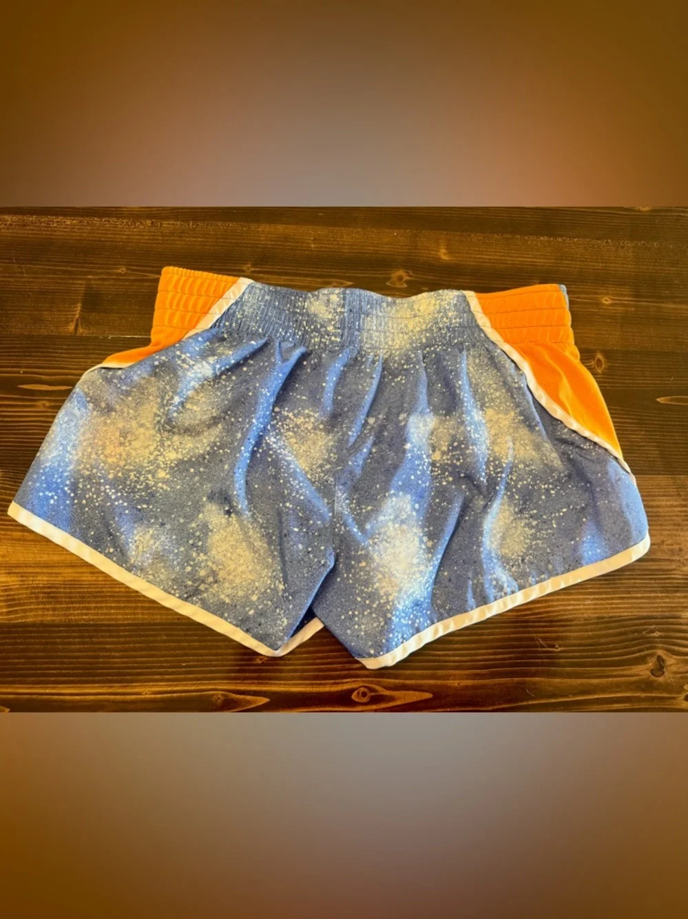 Nike Dri Fit Women’s Blue Splatter Running Shorts with Orange Side Panels M‎